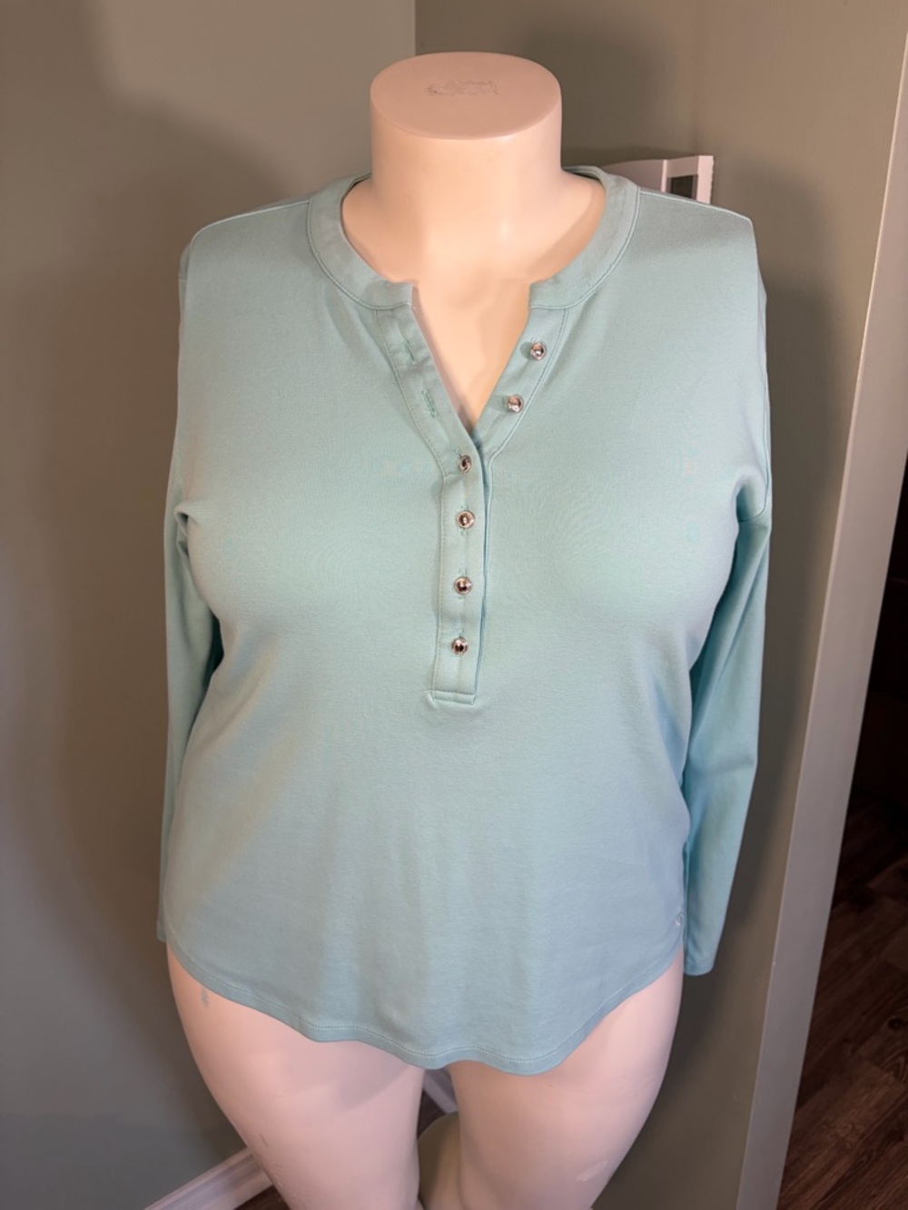 80. Calvin Klein Women’s Long-Sleeve Top in Light Aqua